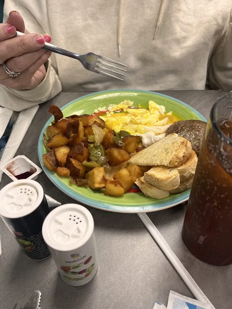 Over Easy Eggs Potatoes Sausage and Toast
